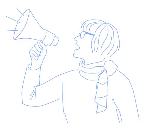 Tarja Rapala-Virtanen holding a megaphone.